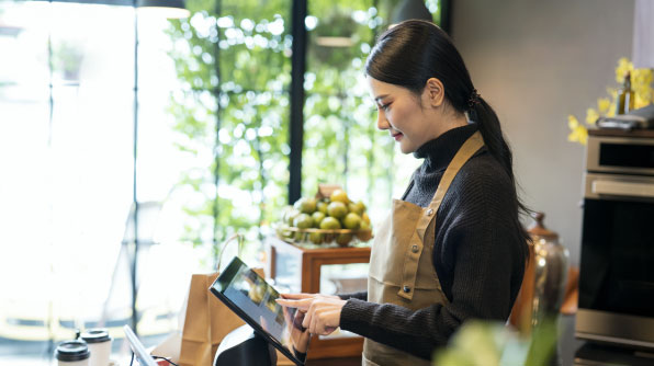 One Person standing and checking Tab with smiley face