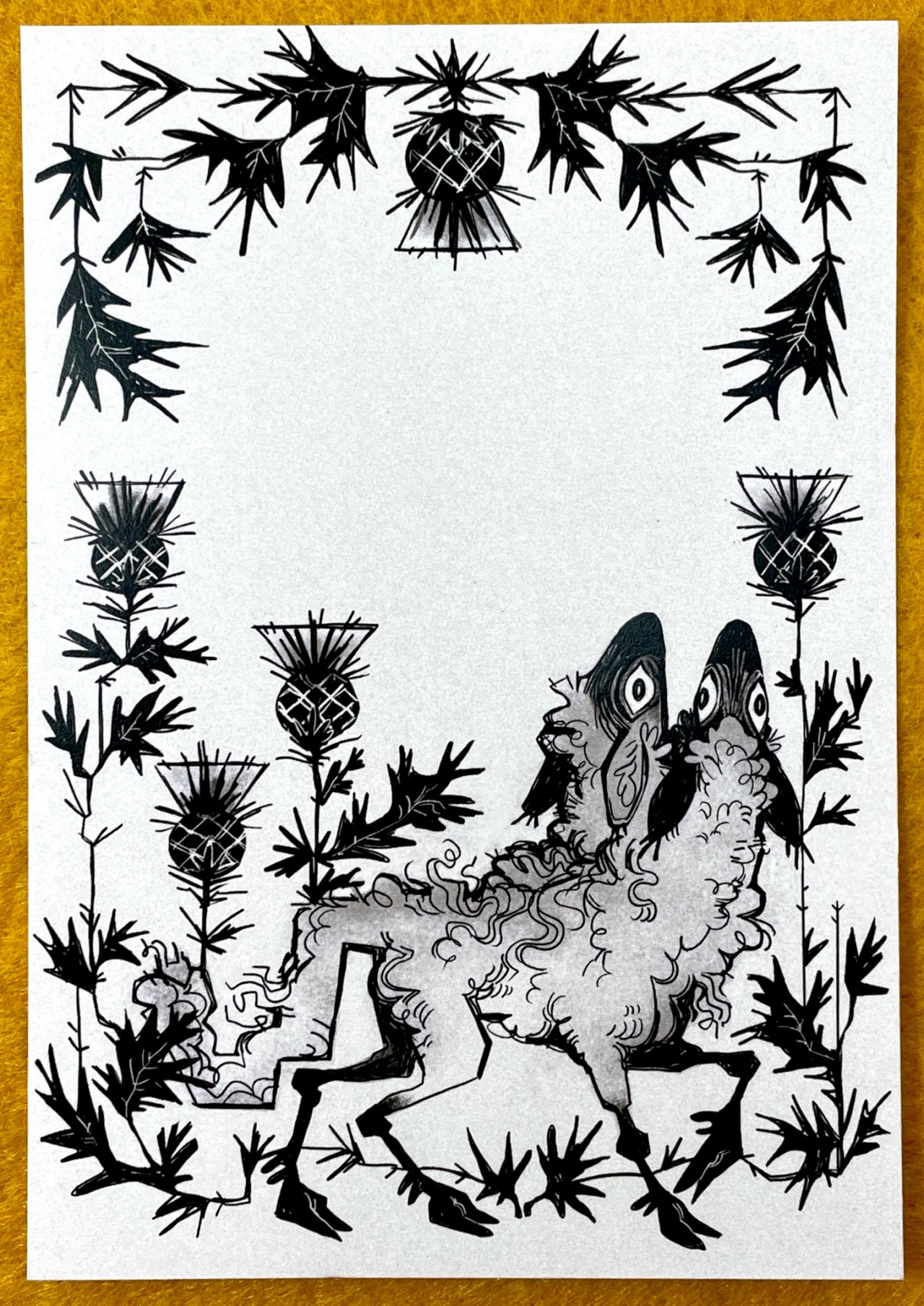 A print in black and white featuring an illustration of a two-headed lamb, mid-stride. Its heads are raised to look upwards, eyes full of awe. Thistle frames the borders of the print, leaving negative space in the centre.