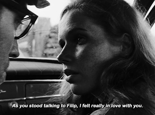 gifs from a scene of the film Shame (Skammen) (1968). gif 1 of 9. a couple is talking inside a parked car. the man tells the woman "as you stood talking to Filip, I felt really in love with you".