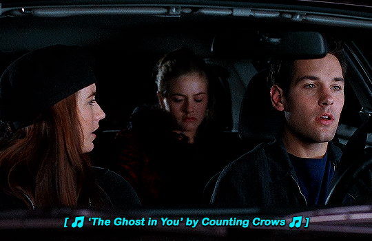 gif 7 of 10. Josh, Cher and the woman Josh was hooking up with are in a car at night. the woman is talking. the subtitles state the song playing in the background, The Ghost in You by Counting Crows.