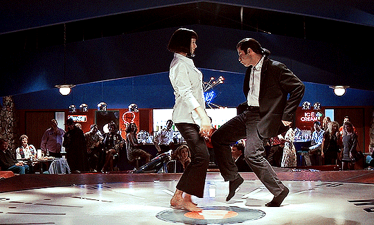 gifs from a scene of Pulp Fiction (1994). a woman and a man dance in a 50s dinner. end ID.