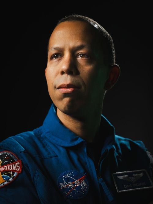 NASA astronaut Chris Williams poses for a portrait at NASA’s Johnson Space Center in Houston, Texas. He looks upward, off into the distance. Credit: NASA/Josh Valcarcel