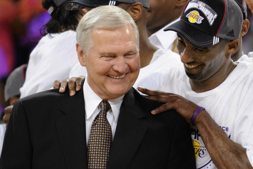 Los Angeles Lakers' Kobe Bryant gives basketball great Jerry West a shoulder rub after the Lakers beat the San Antonio Spurs 100-92 in Game 5 of the NBA Western Conference basketball finals, Thursday, May 29, 2008 in Los Angeles. (AP Photo/Kevork Djansezian)