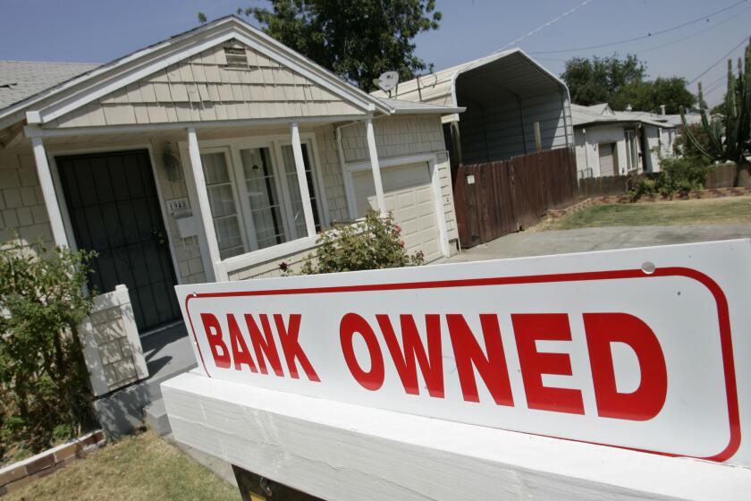 A sign of a house under foreclosure is shown in Antioch, Calif., Thursday, Aug. 14, 2008. (AP Photo/Paul Sakuma)