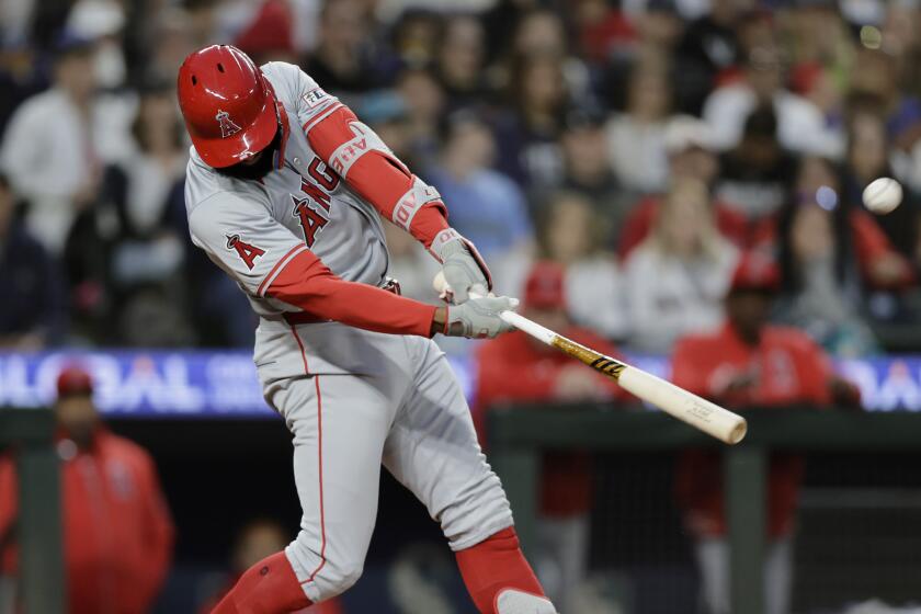 Los Angeles Angels' Jo Adell hits a grand slam off Seattle Mariners pitcher Tayler Saucedo.