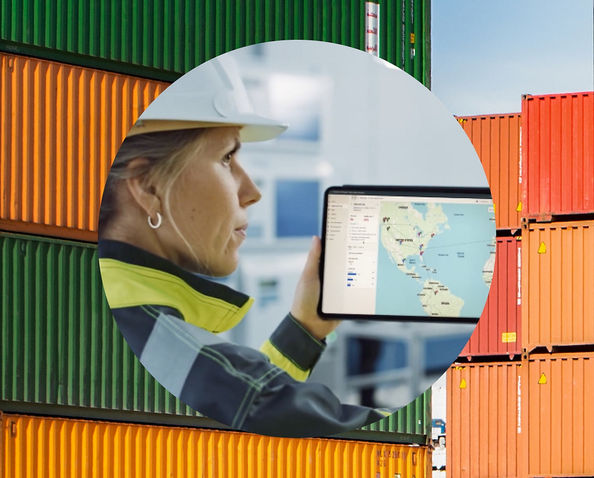 A woman worker checking map and statistics on a table with background as shipping containers
