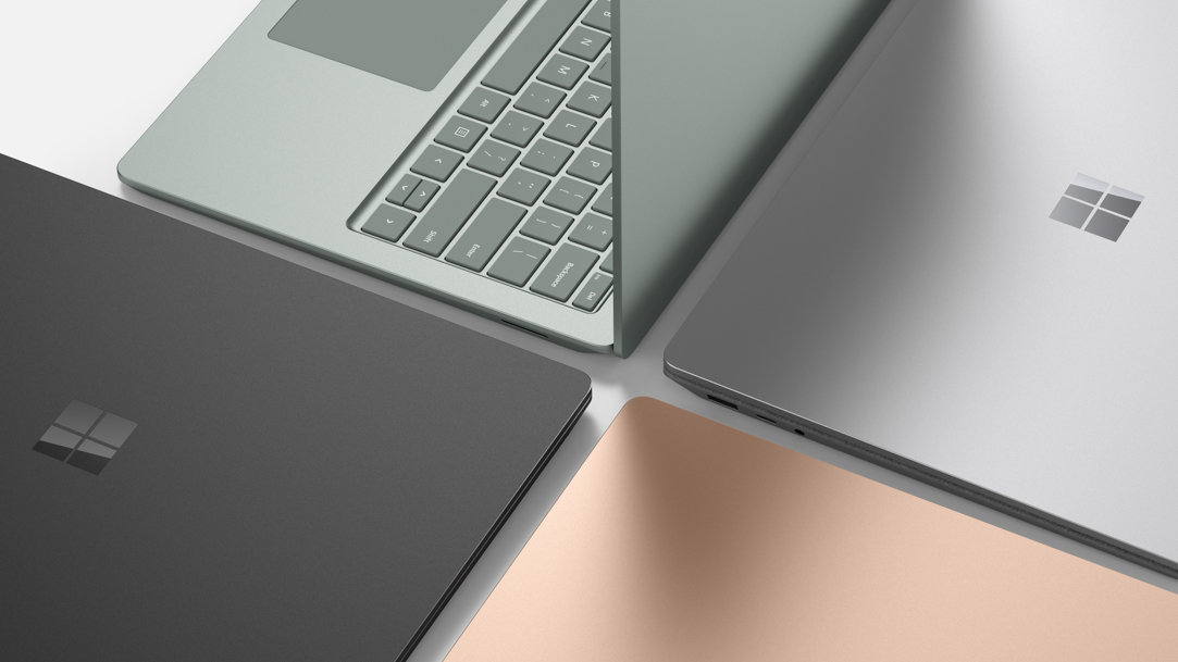 Close up of Surface Laptop 5 in rose gold, silver, black, and green