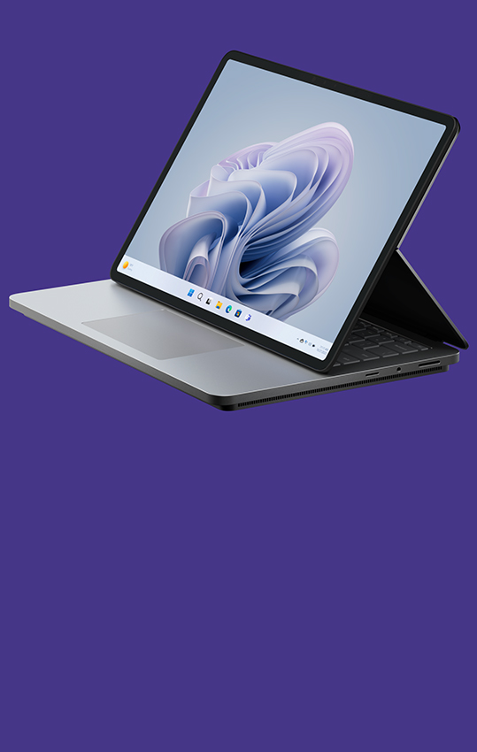 Surface Laptop Studio 2 的側面角度，螢幕顯示 Windows 花朵畫面。