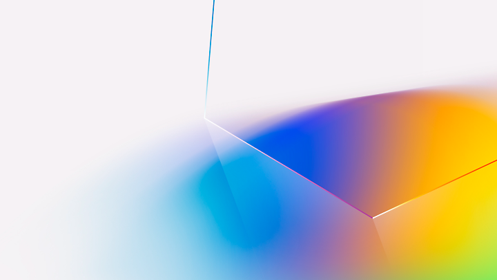 Abstract image featuring a gradient of light blue, purple, and orange colors with sharp angles and smooth blending