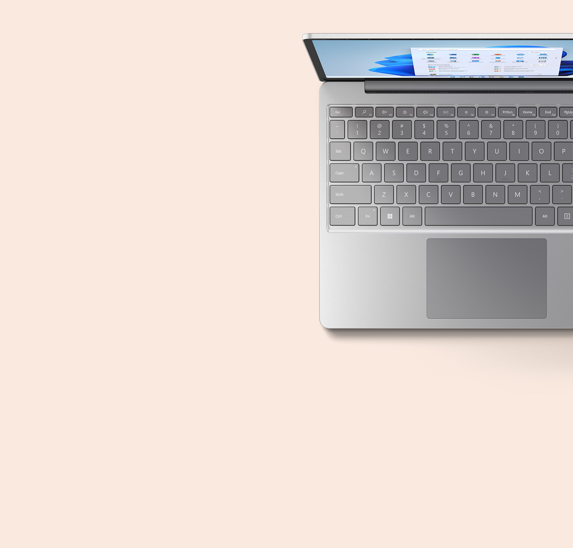 ภาพจากด้านบนของ Surface Laptop Go 2 สีแซนด์สโตน พร้อมคีย์บอร์ด
