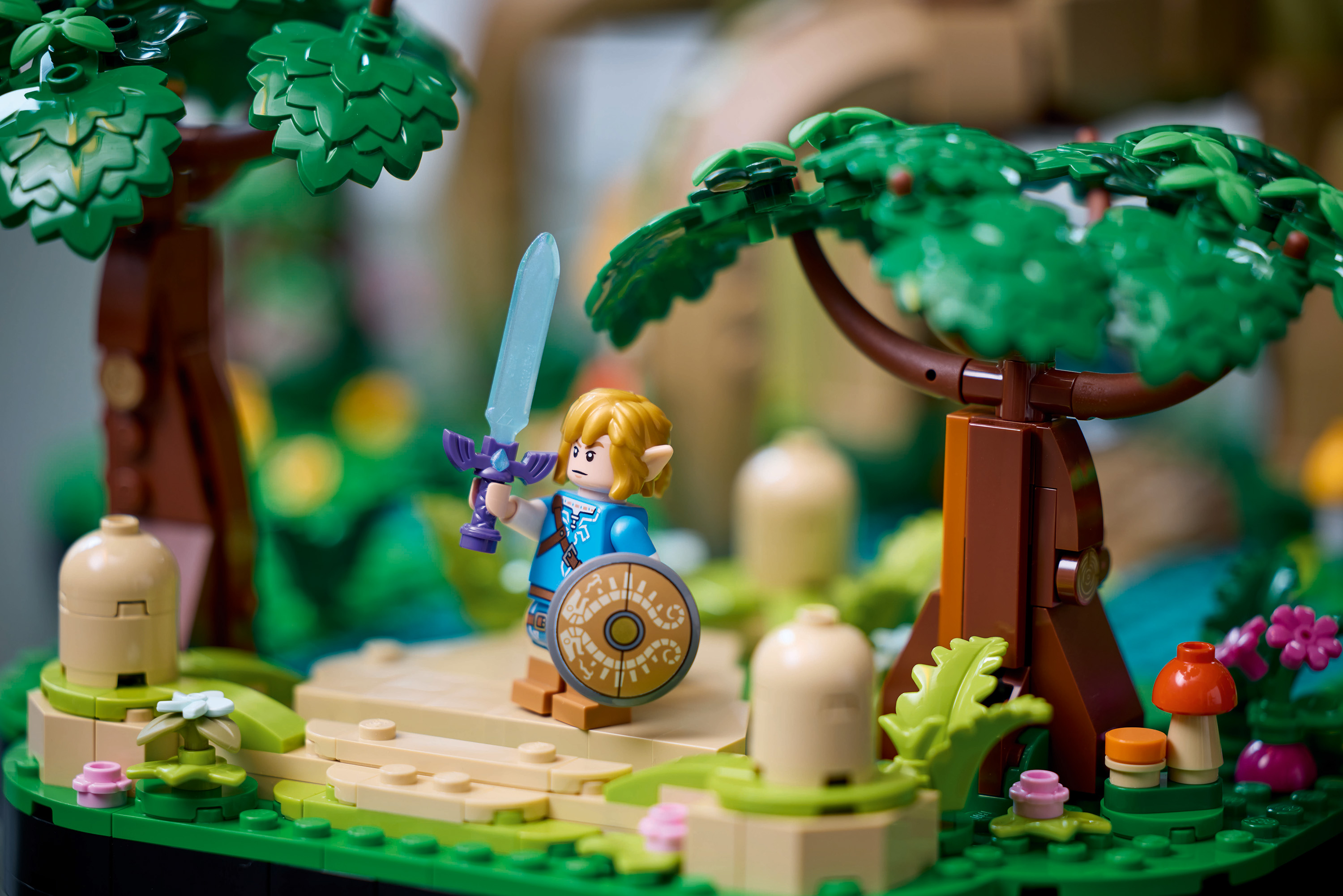 Lego minifig of Link stands in the Great Deku Tree with his sword up