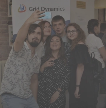 a Grid Dynamics team is taking a photo