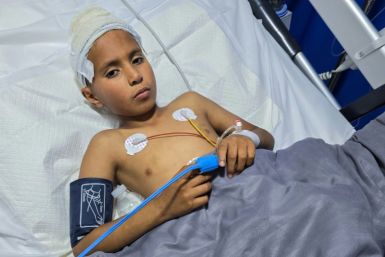 Mohamed Farhat, 10, is treated in a Tripoli hospital for injuries caused by an unexploded ordnance