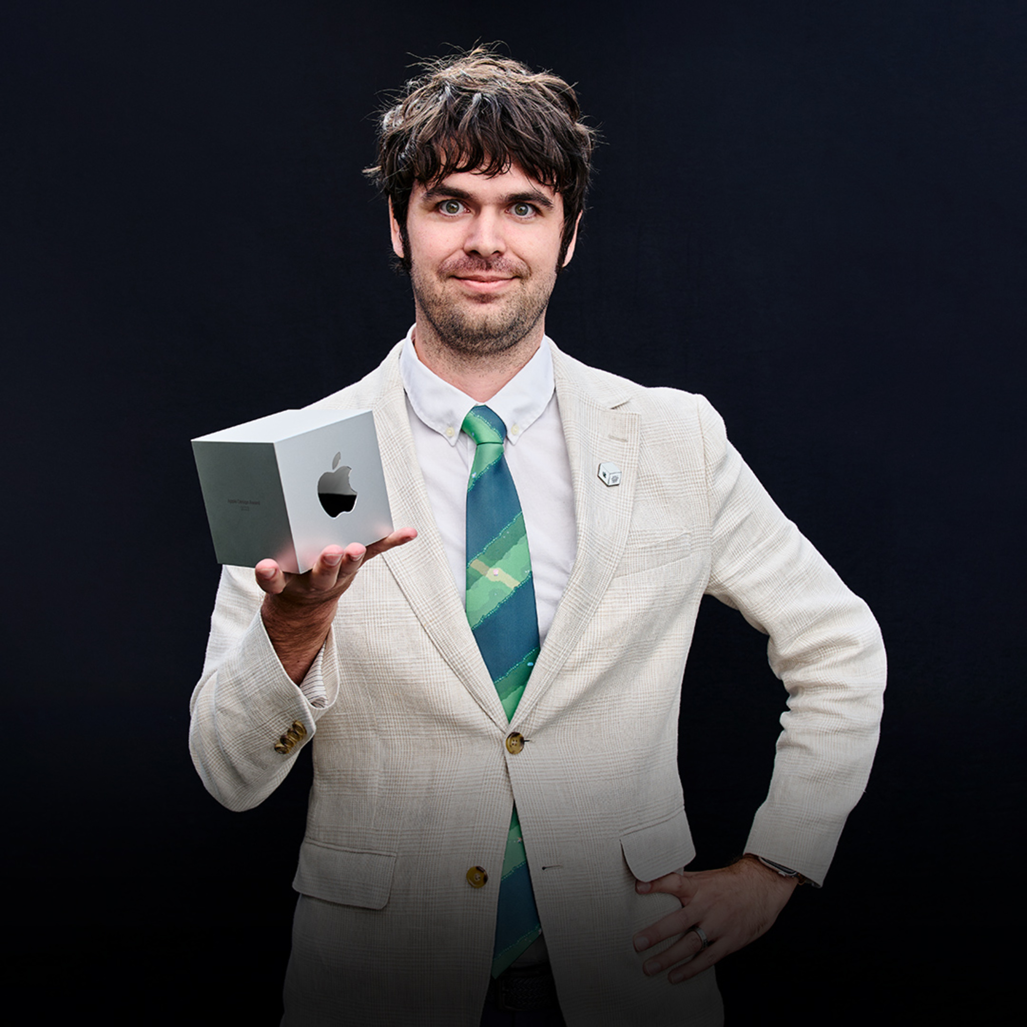 A portrait of Evan Kice, Afterplace creator, holding his Apple Design Award.