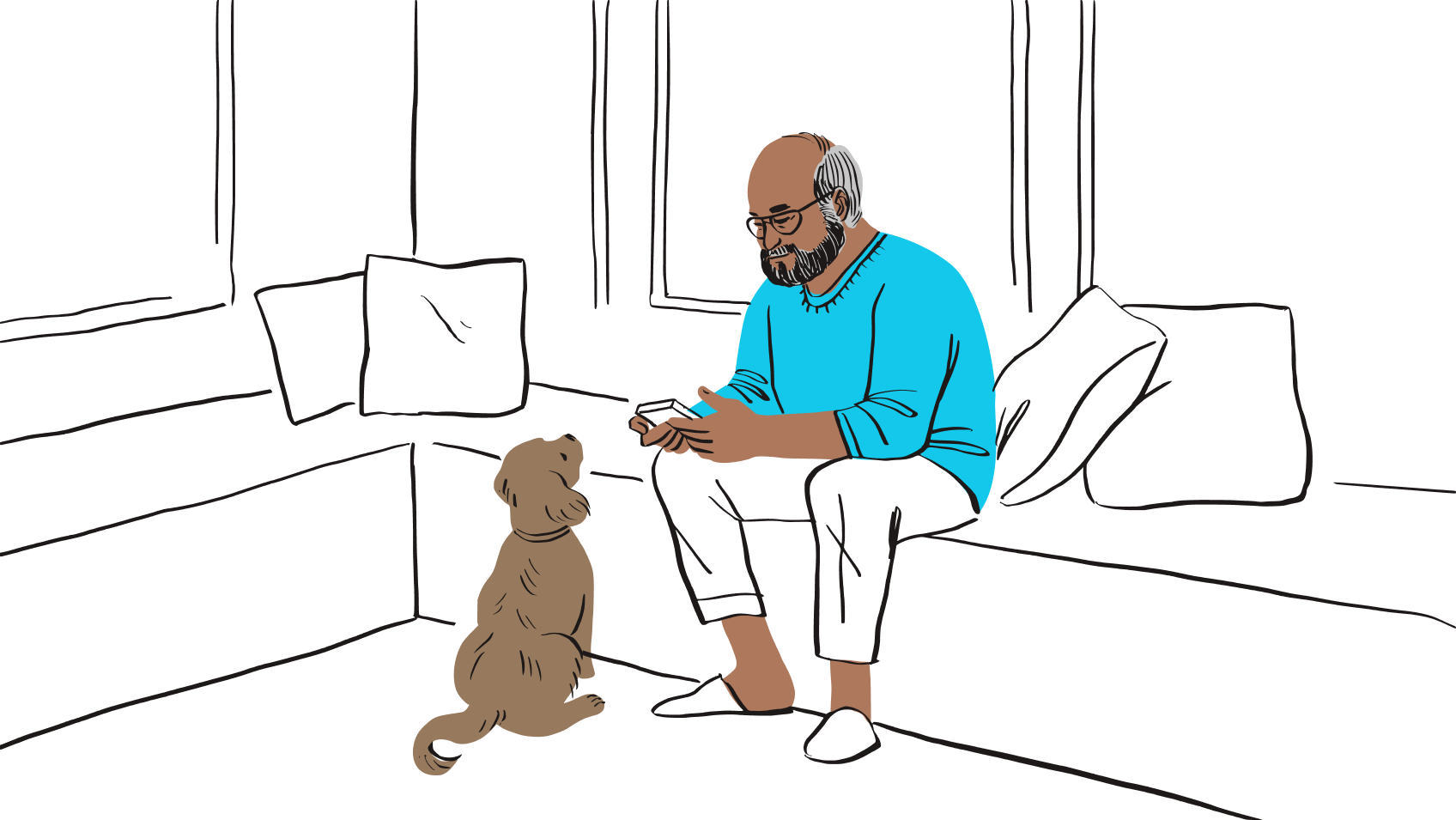 En mand sidder på en bænk og kigger på telefonen, med en hund, der kigger op på ham