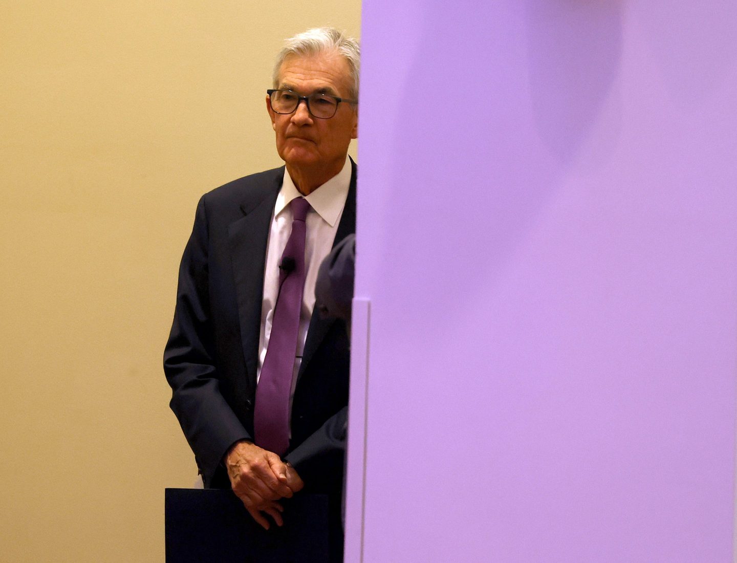 Jerome Powell looks on before speaking