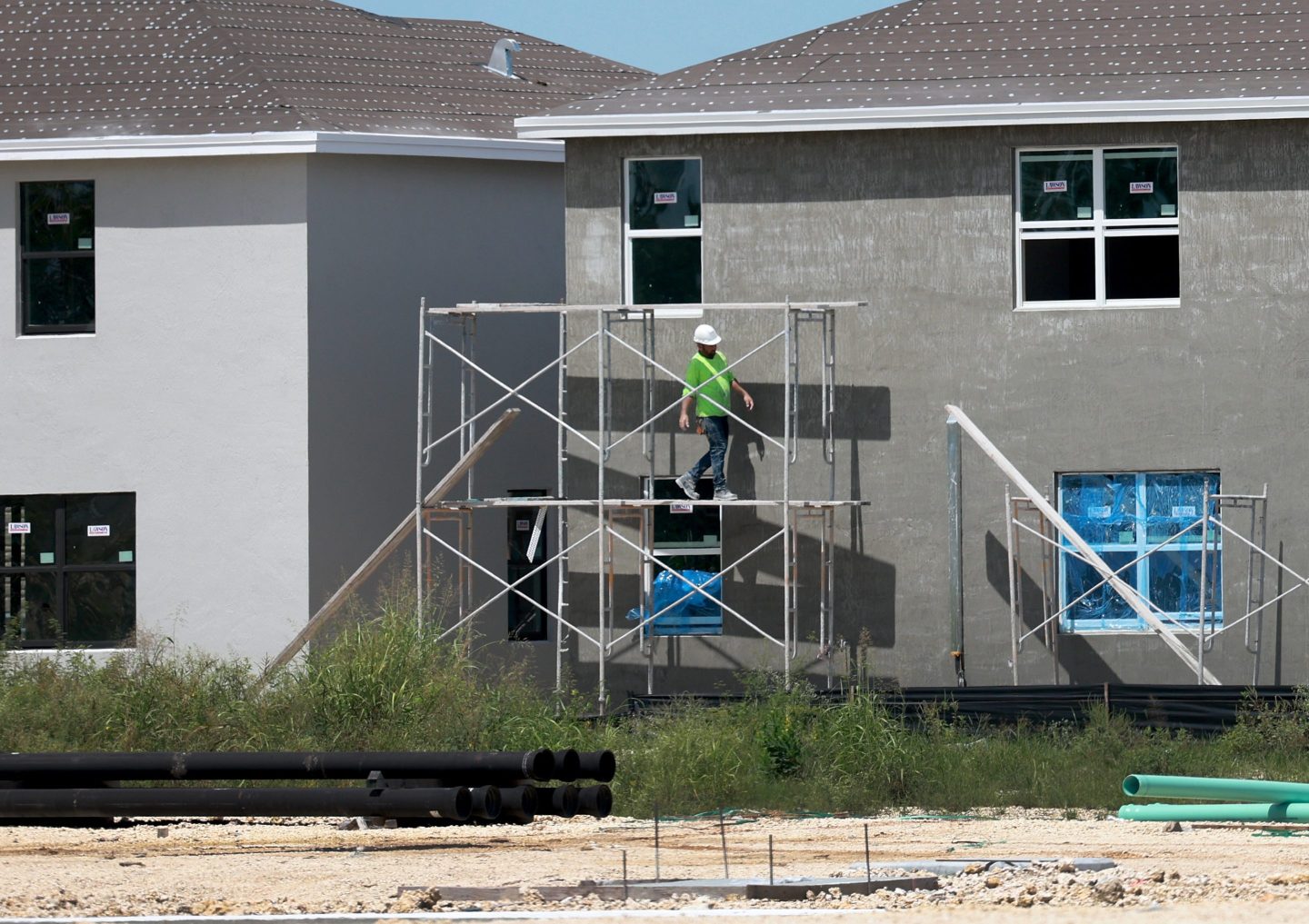 MIAMI, FLORIDA &#8211; SEPTEMBER 22: A worker helps build a new home on September 22, 2023 in Miami, Florida. With high borrowing costs, people are reluctant to sell, creating a reported nationwide shortage of houses for sale. (Photo by Joe Raedle/Getty Images)