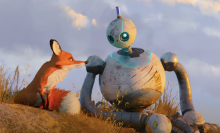 A fox and a robot sit together in animated film "The Wild Robot"