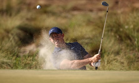 Rory McIlroy hits out of a bunker on the 10th hole during a third round 69 at the US Open.