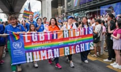 People holding a rainbow banner that reads: 'LGBTi rights = human rights'