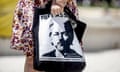 Stella Assange, wife of Julian Assange, co-founder of WikiLeaks, carries a bag with the picture of her husband