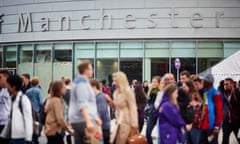 Manchester University students walk past the student union