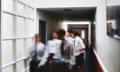 Blurred image of pupils walking along school corridor