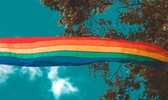 Rainbow flag flying in the Californian blue sky