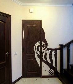 an image of a door with the words in russian on it and a staircase leading to another room