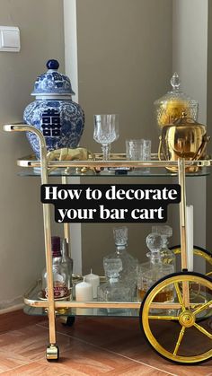 a bar cart with drinks on it and the words how to decorate your bar cart