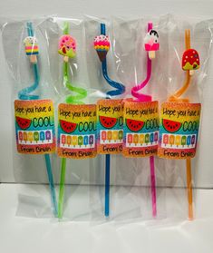 three colorful toothbrushes in plastic bags with designs on them and saying, hope you have a cool birthday