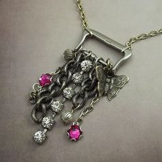the necklace has many charms attached to it