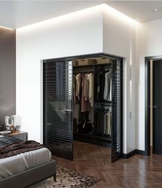 an open closet in the corner of a bedroom