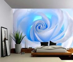a bedroom with a large white rose on the wall