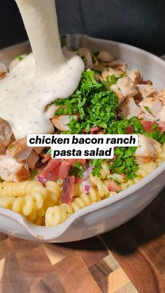 the chicken bacon ranch pasta salad is ready to be eaten with a dressing drizzled on top