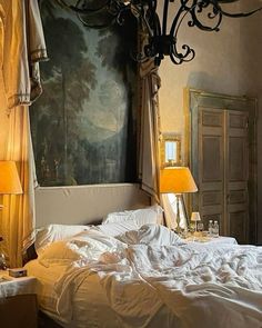 a bedroom with a large painting on the wall