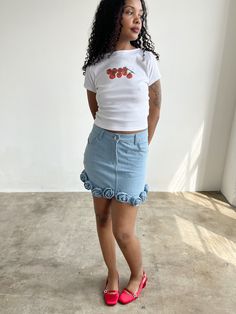 The best selling Lisa Says Gah baby tee with an adorable tomato illustration to channel your inner 🍅 girl. Details Classic white cropped baby t-shirt in a lightweight cotton jersey100% Deadstock CottonMachine wash cold, gentle, lay flat to dry only. Do not bleach. Made in Los AngelesModels wear a size S Size Bust Total