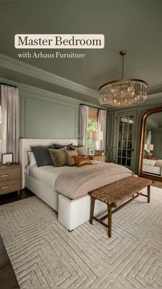 a bedroom with a large bed and a chandelier hanging from it's ceiling