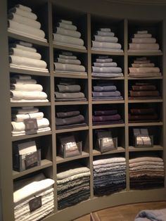 a closet filled with lots of folded towels