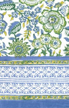 blue and green floral print fabric with white stripes on the bottom, two different colors