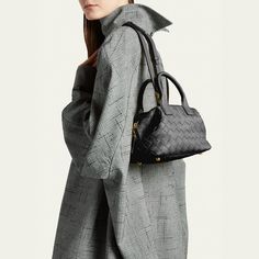 Bottega Veneta "Bauletto" top handle bag in intrecciato leather  Top handles  Detachable, adjustable shoulder strap, 19.1" drop Can be worn as a top handle or shoulder bag  Two-way zip top closure  Feet protect bottom of bag  Approx. 6.1"H x 8"W x 3.9"D Made in Italy
