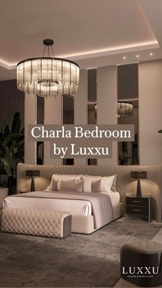 a large bed sitting in the middle of a bedroom next to a chandelier