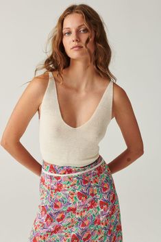 The DILLY tank top was made for the summer. Cropped and tied in back, this top is the summer version of our FILL sweater which may already be in your collection. A true ba&sh icon, DILLY is designed with fine knit and half-cardigan stitch. What's more, this top is reversible. Two tops in one, what a great idea! DILLY will look great with pants, a skirt, or high-rise jeans. Material: 81% LINEN / 19% POLYAMIDE Trousers, Summer Outfits, Outfits, Wardrobes, Tops, Jumpers, Tank Tops, Tank Tees, Sweaters
