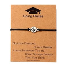 a bracelet that says go in the direction of your dreams and is attached to a card