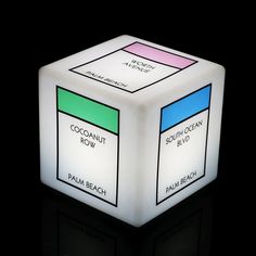 an illuminated cube with the words coconutnut row and palm beach on it's sides