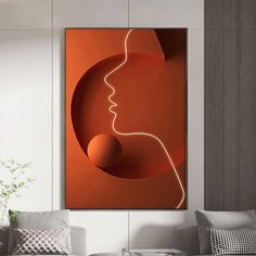 a woman's face is shown in an orange and white room with modern furniture