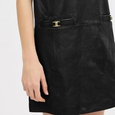 A sleek minimalist style to be worn alone or layered over a top this sleeveless dress is crafted of buttery soft leather. Detailed with our Heritage C Plaque the scoop neck design is finished with front slip pockets and a back zip closure. | Coach Heritage C Leather Dress - Women's Size 14 - Black