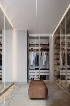 a walk in closet filled with lots of clothes and shoes on shelves next to a bed