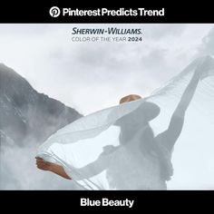 a woman holding a white sheet in the air with mountains behind her and text that reads sherwin - williams color of the year 2012