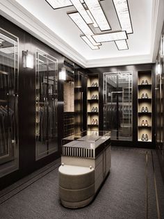 an empty walk in closet with lots of shoes